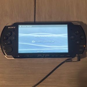 PSP with 5 games and charger